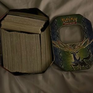 Pokémon tin full of cards